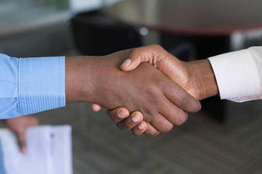 Handshake between two people, showing only their hands