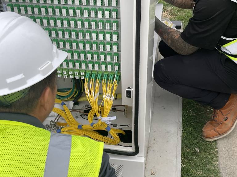 NetPMD team installing new network cabinets